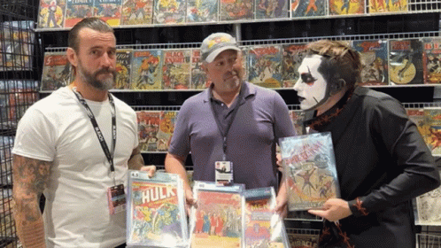 Three Men in Front of Comic Book Wall