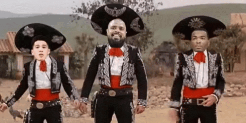 Three Men in Mariachi Costumes Dancing