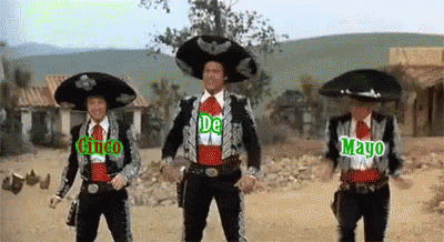 Three Men in Mariachi Costumes Dancing