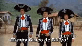 Three Men in Mariachi Costumes Saying Happy Cinco de Mayo
