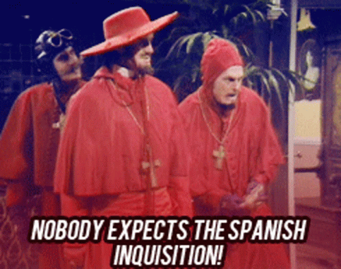 Three Men in Red Robes Saying Nobody Expects the Spanish Inquisition