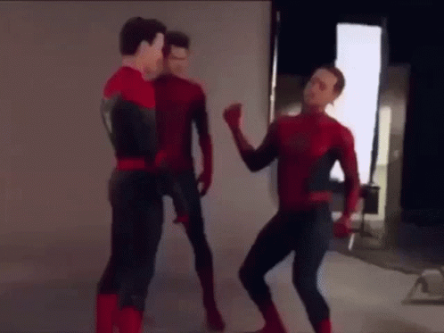 Three Men In Spiderman Costumes Are Standing Next To Each Other And Dancing . GIF