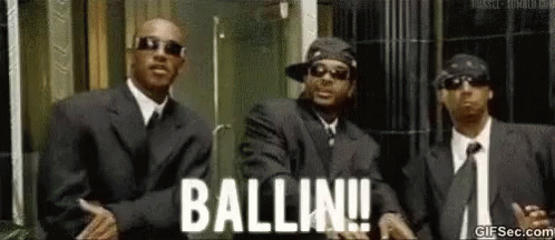 Three Men in Suits Saying Ballin