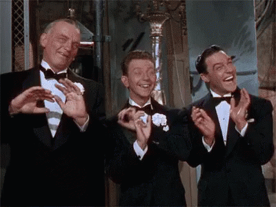 Three Men in Tuxedos Clapping