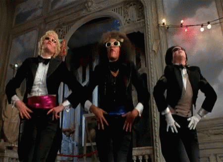 Three Men in Tuxedos Dancing