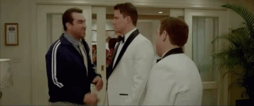 Three Men In Tuxedos Shaking Hands GIF