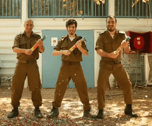 Three Men Military Uniforms Holding Fireworks Blue Door