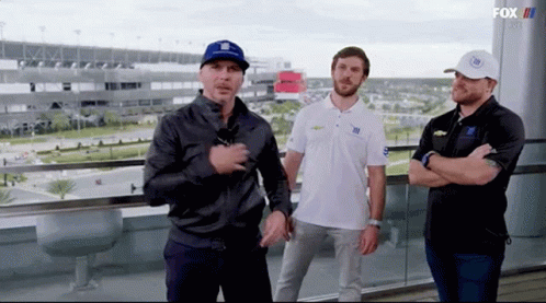 Three Men on Balcony Fox TV Logo