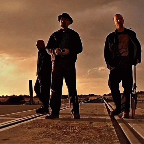 Three Men on Train Tracks Wearing Apocalypse T-Shirt