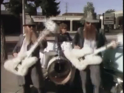 Three Men Playing Guitars And Drums In Band GIF
