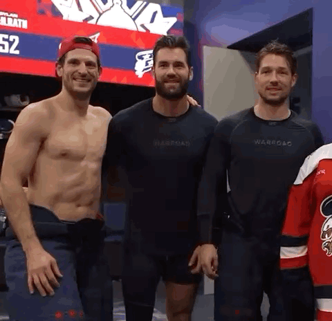 Three Men Posing In Locker Room GIF