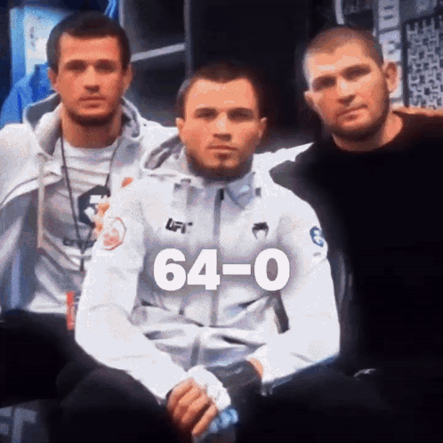 Three Men Posing With 64-0