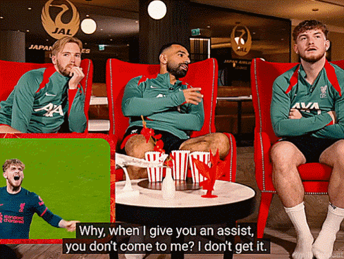 Three Men Red Chairs One Wearing Liverpool Jersey GIF