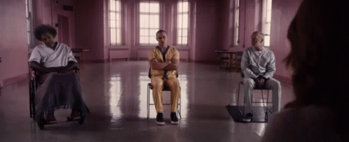 Three Men Sitting in Chairs