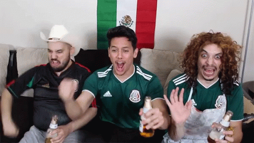 Three Men Sitting on Couch With Beer and Mexican Flag