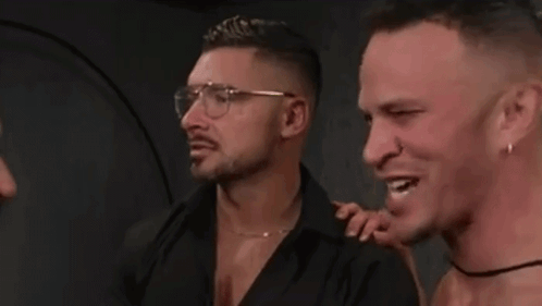 Three Men Smiling, One With Glasses And Earrings GIF