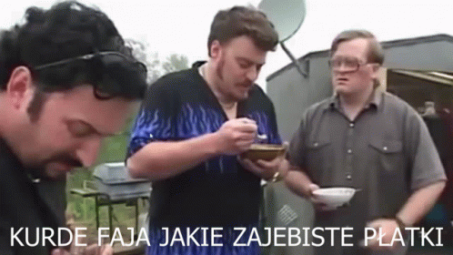 Three Men Standing Eating From Bowls and Plates