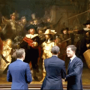 Three Men Standing In Front Of A Large Painting GIF