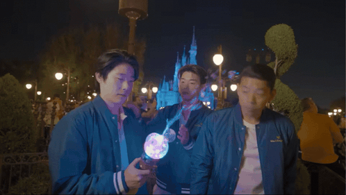 Three Men Standing In Front Of Castle Saying Focus Focus GIF