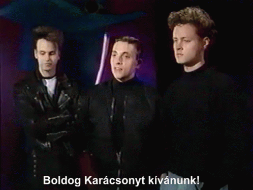 Three Men Standing Together Boldog Karacsonyt Kivanunk