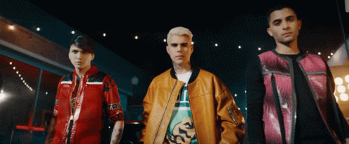 Three Men Standing With One Wearing TRX Jacket GIF