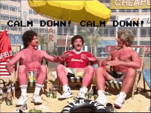 Three Men Under Beach Umbrella Calm Down