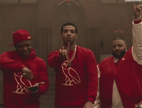 Three Men Wearing Red Sweaters With An Owl On Them Are Standing Next To Each Other . GIF
