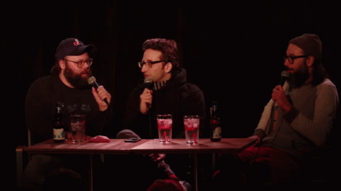 Three Men With Microphones and Scoop