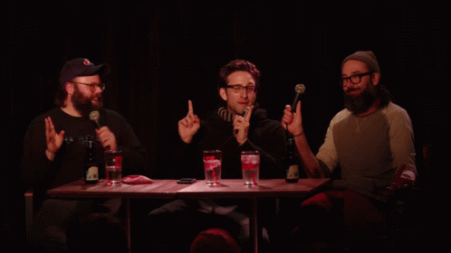 Three Men With Microphones and Yellow Scoop