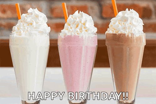 Three Milkshakes With Whipped Cream And Straws With The Words Happy Birthday Written On The Bottom GIF