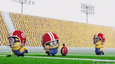 Three Minions Are Playing Football On A Field Wearing Helmets And Goggles . GIF