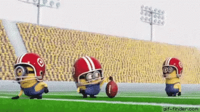 Three Minions Are Playing Football On A Field Wearing Helmets And Holding A Football . GIF
