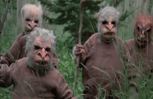 Three Monsters Standing in Grass
