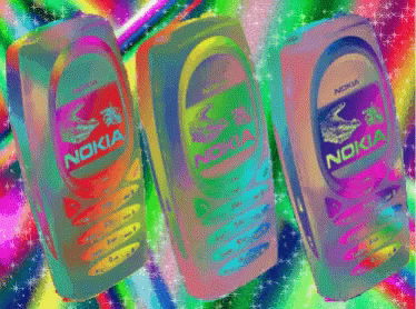 Three Nokia Cell Phones Are Lined Up In A Row GIF