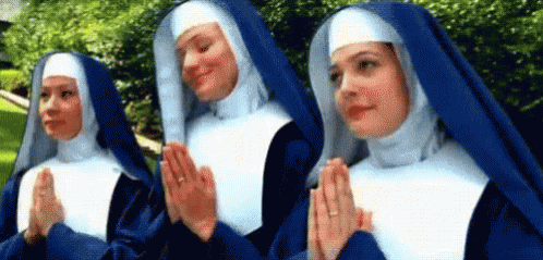 Three Nuns in Blue Robes Praying