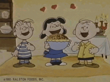 Three Peanuts Characters Standing in Room