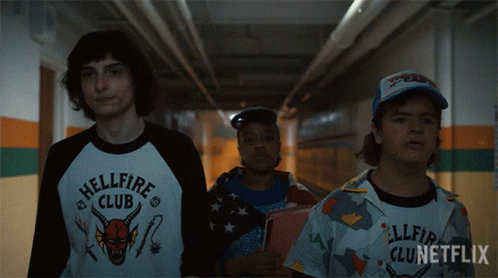 Three People Walking Down Hallway Hellfire Club Shirt