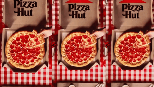 Three Pizza Hut Boxes Are Lined Up On A Checkered Tablecloth GIF