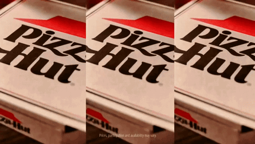 Three Pizza Hut Boxes Are Sitting On A Wooden Table GIF