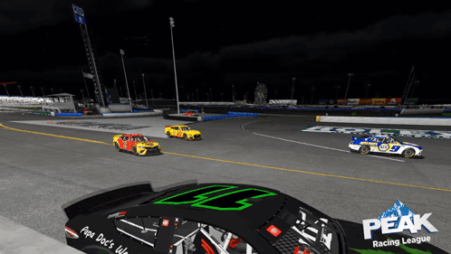 Three Race Cars Are On A Track With The Words Peak Racing League On The Side GIF