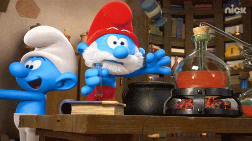 Three Smurfs Are Standing Around A Table With A Nick Logo On The Bottom Right GIF