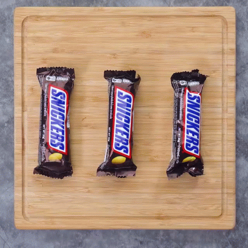 Three Snickers Bars Lined Up