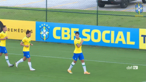 Three Soccer Players Are Running On A Field In Front Of A Banner That Says Cbf Social Tod GIF