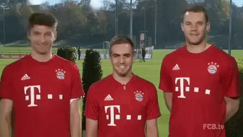 Three Soccer Players Red T-Mobile Jerseys Together