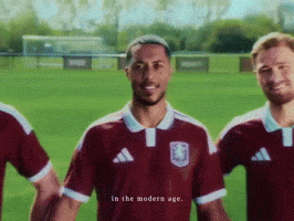Three Soccer Players Standing On Field In The Modern Age GIF