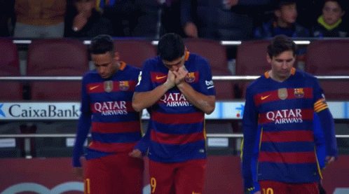 Three Soccer Players Wearing Qatar Airways Jerseys Stand Together GIF