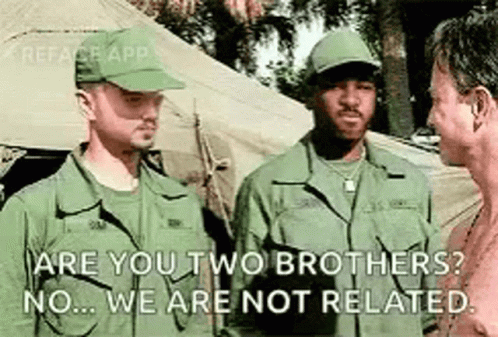 Three Soldiers Talking in Front of Tents