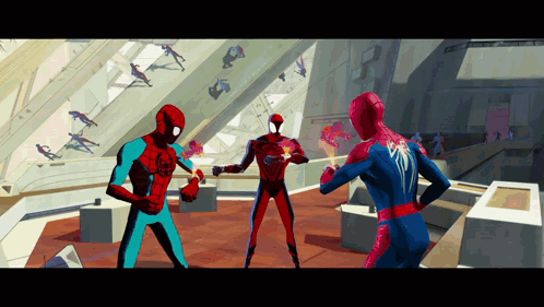 Three Spider-Man Are Standing In A Room And One Of Them Has The Word Spider-Man On His Chest GIF