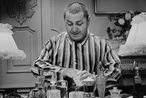 Three Stooges Curly Putting Lotion On Face GIF
