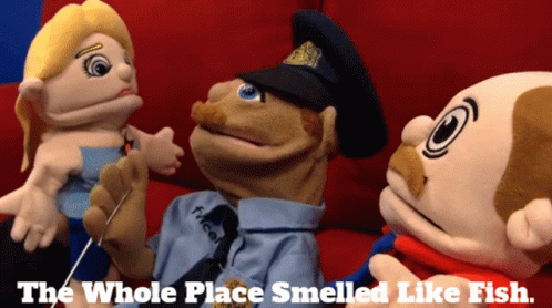 Three Stuffed Animals Are Sitting On A Couch With The Words The Whole Place Smelled Like Fish Below Them GIF
